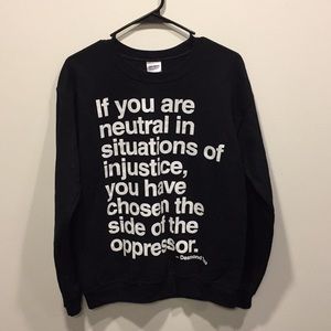 Black crewneck sweater with Desmond Tutu quote